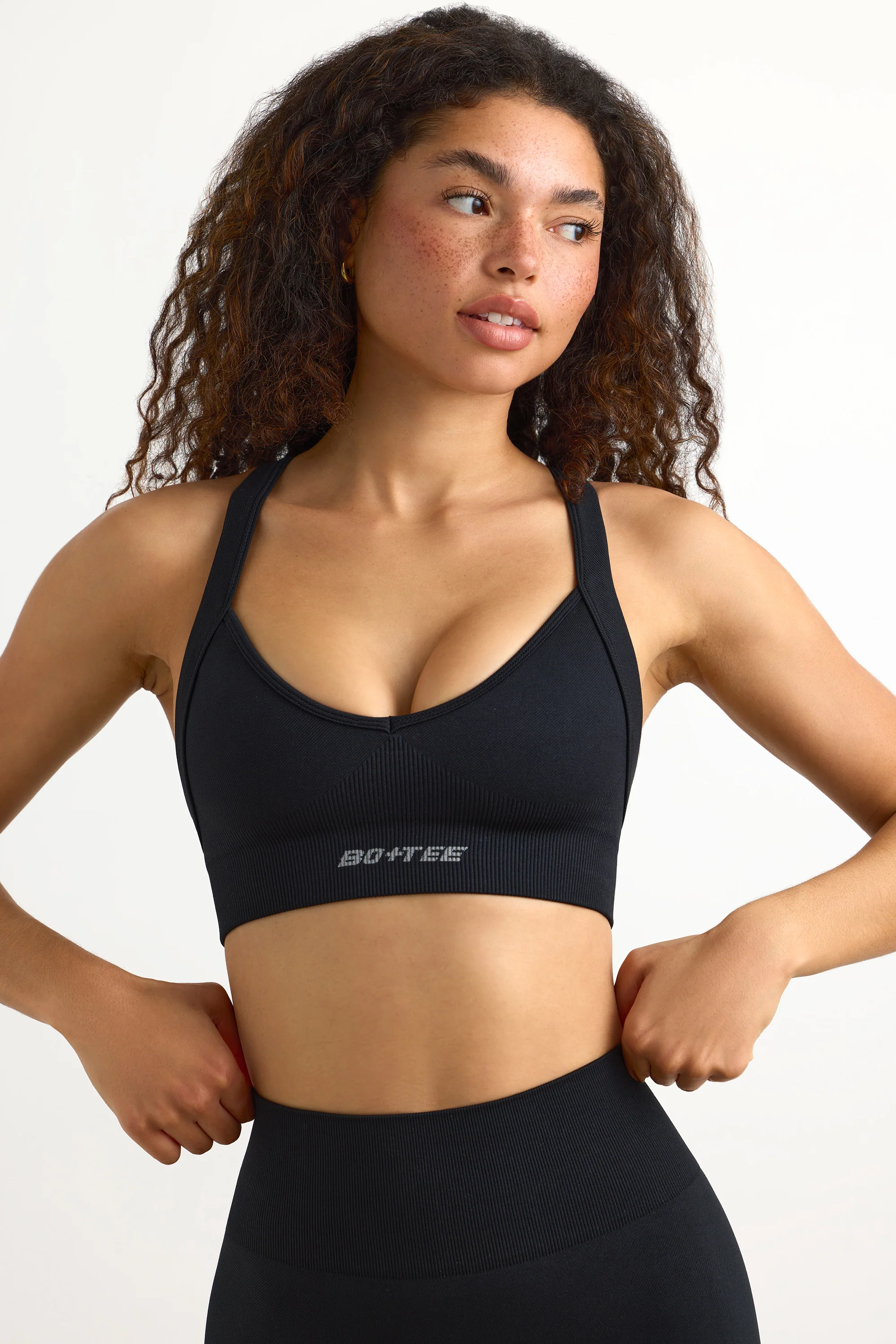 Super Sculpt Seamless Cross-Back Sports Bra in Black - Image 6